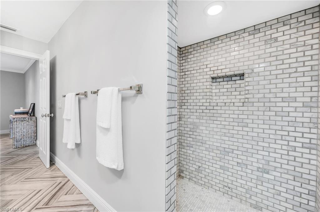 1966 Imperial Golf Course Boulevard Naples, FL 34110 - Photo 23 of 32 a bathroom with a shower