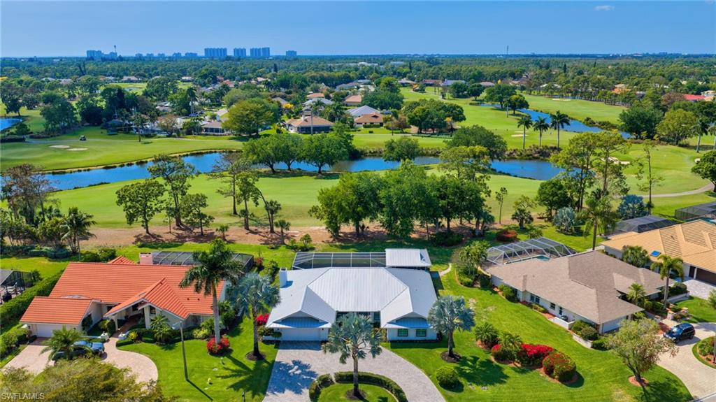1966 Imperial Golf Course Boulevard Naples, FL 34110 - Photo 28 of 32 an aerial view of a house with a garden