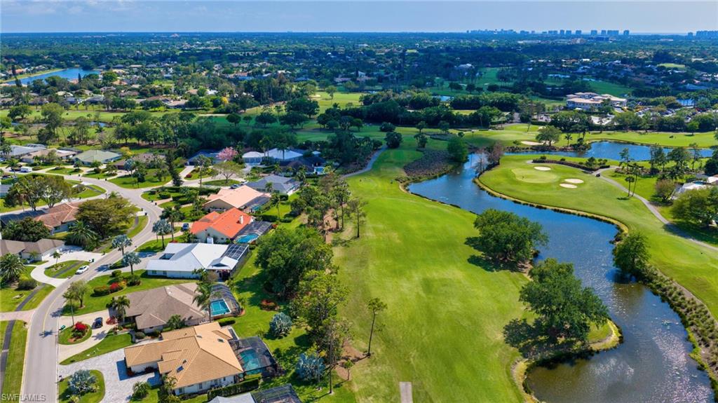 1966 Imperial Golf Course Boulevard Naples, FL 34110 - Photo 30 of 32 an aerial view of lake residential houses with outdoor space and swimming pool