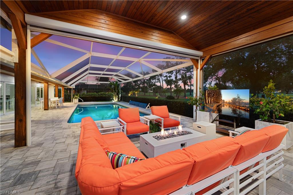 1966 Imperial Golf Course Boulevard Naples, FL 34110 - Photo 32 of 32 a outdoor space with the couches and dining table with the view of swimming pool