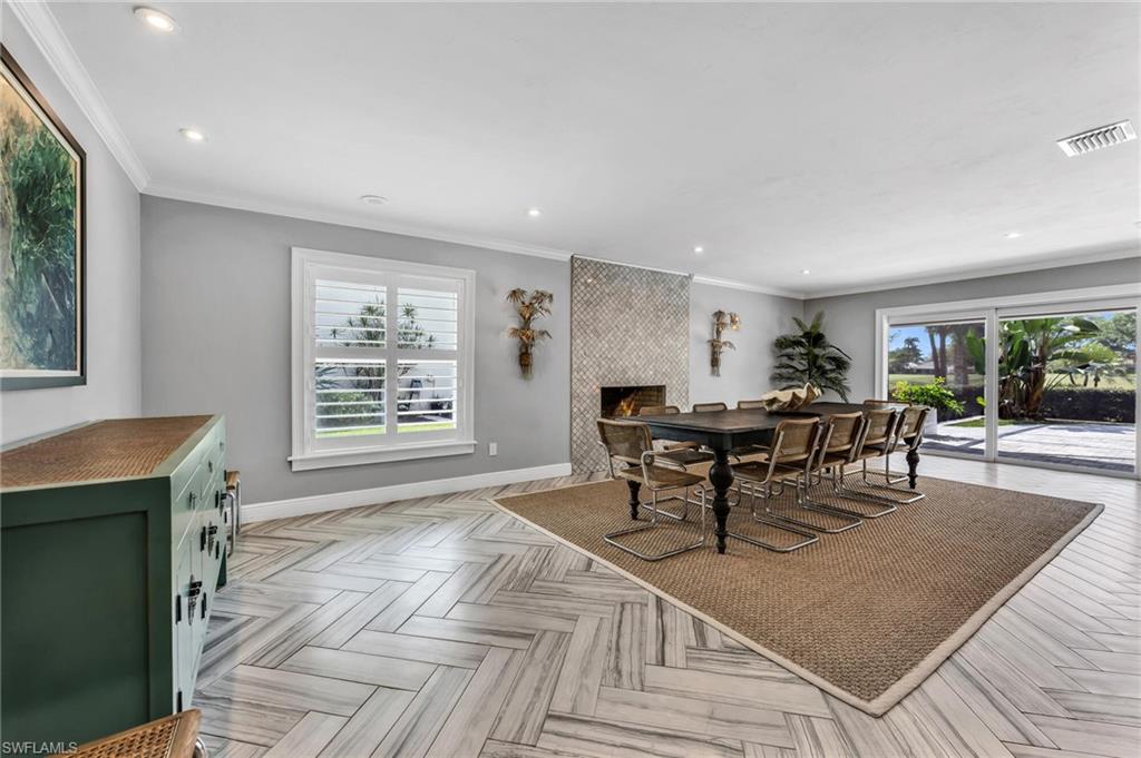1966 Imperial Golf Course Boulevard Naples, FL 34110 - Photo 10 of 32 a dining room with furniture and window