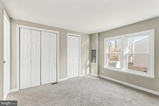 a big room with windows and closet