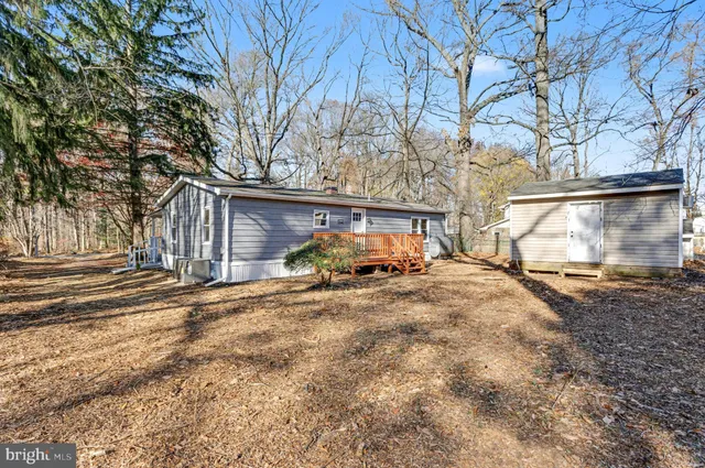 a view of a backyard of the house