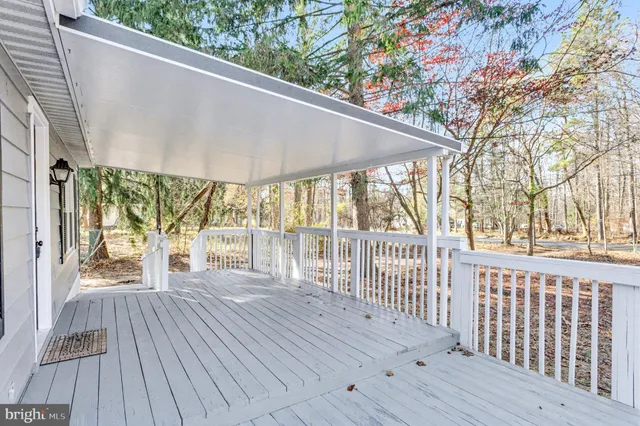 a porch with wooden floor and outdoor space