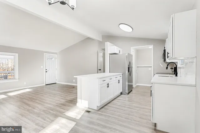 a view of a kitchen with electric appliances