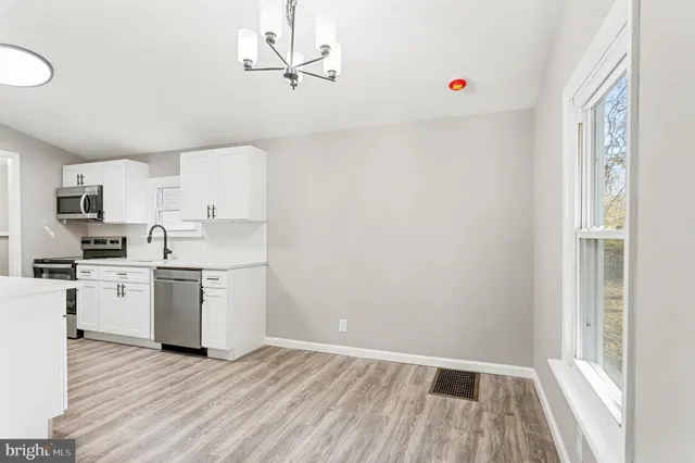 a view of kitchen with wooden floor