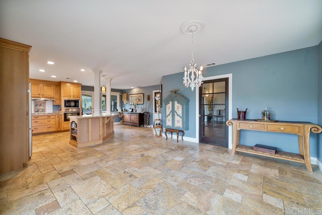 2719 Vía Del Robles Fallbrook, CA 92028 - Photo 12 of 48 a view of a living room and kitchen