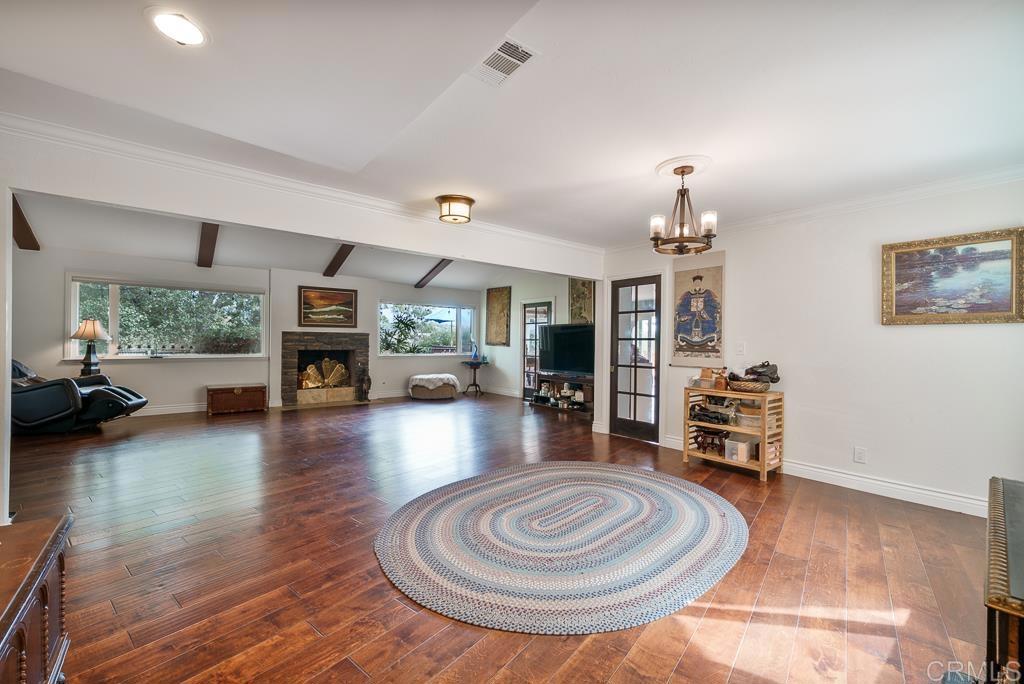 2719 Vía Del Robles Fallbrook, CA 92028 - Photo 18 of 48 a living room with furniture and a wooden floor