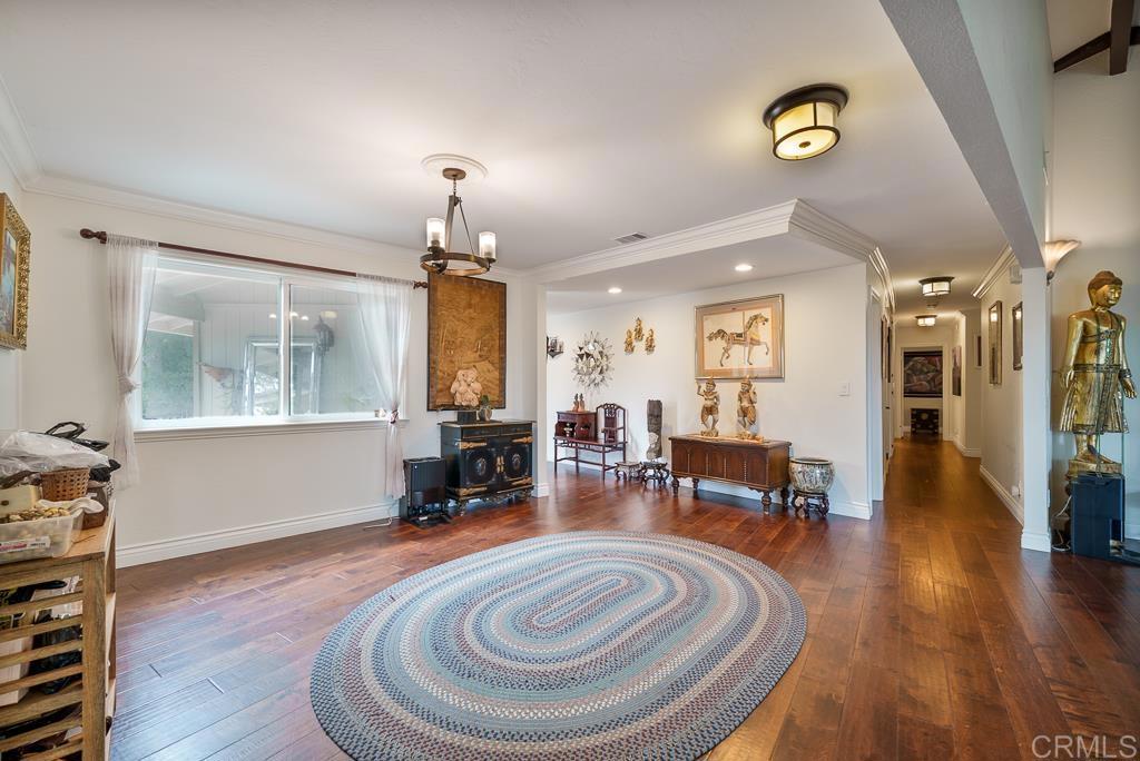 2719 Vía Del Robles Fallbrook, CA 92028 - Photo 20 of 48 a living room with furniture and a fireplace
