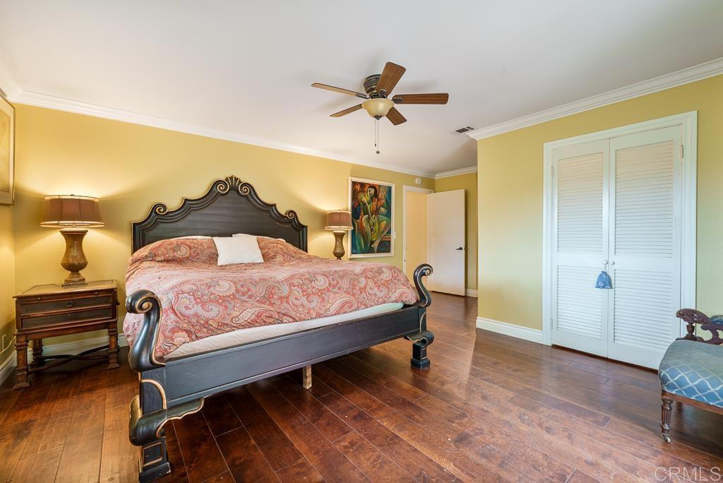 2719 Vía Del Robles Fallbrook, CA 92028 - Photo 28 of 48 a bedroom with a bed and wooden floor