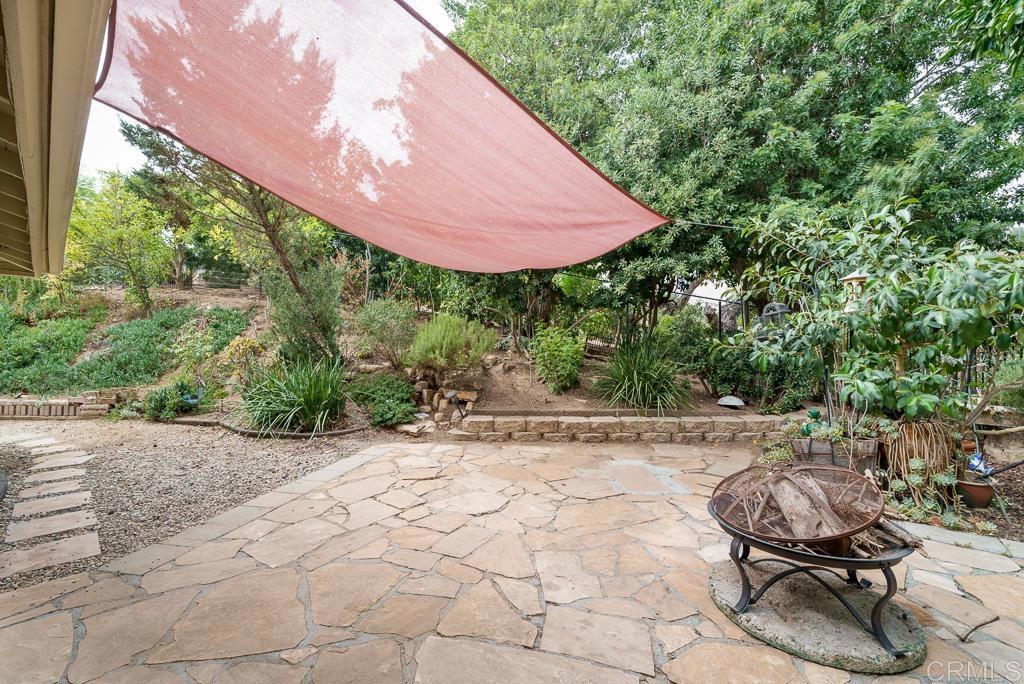 2719 Vía Del Robles Fallbrook, CA 92028 - Photo 40 of 48 a backyard of a house with yard and outdoor seating