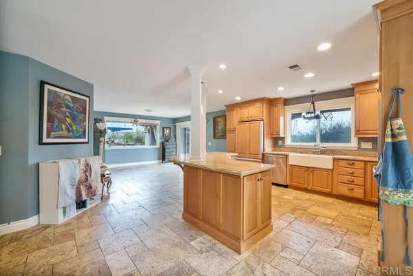 a kitchen with stainless steel appliances granite countertop a stove and a sink