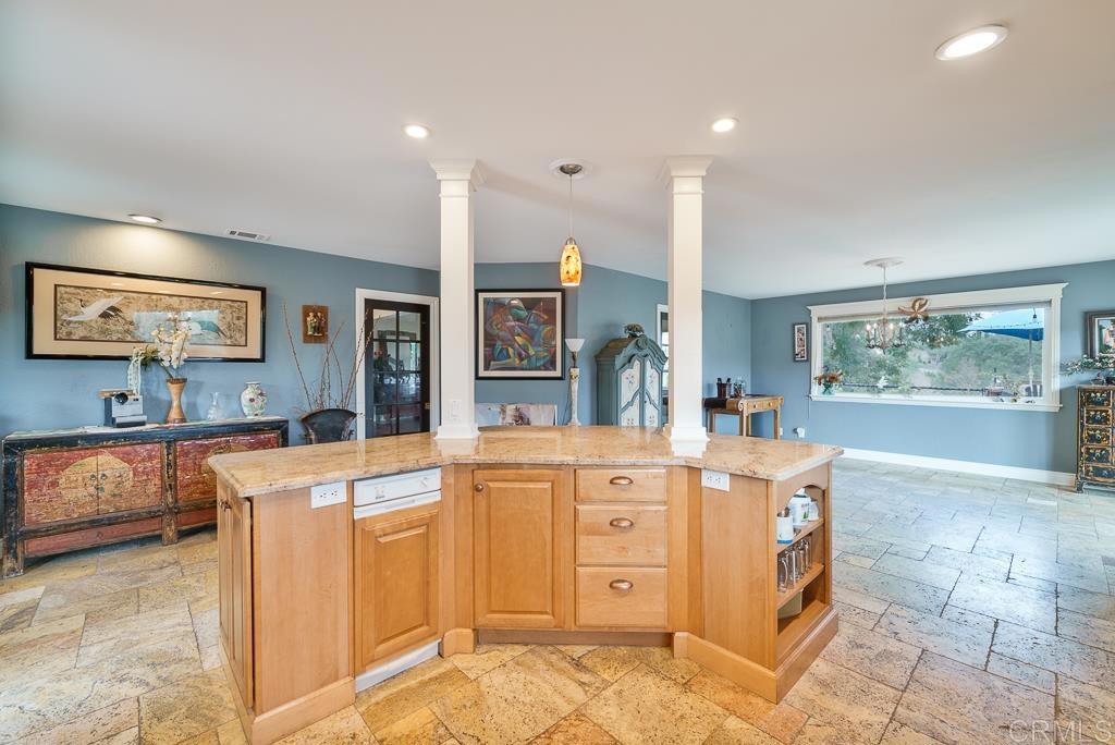2719 Vía Del Robles Fallbrook, CA 92028 - Photo 10 of 48 a large kitchen with stainless steel appliances granite countertop a large counter top and a stove