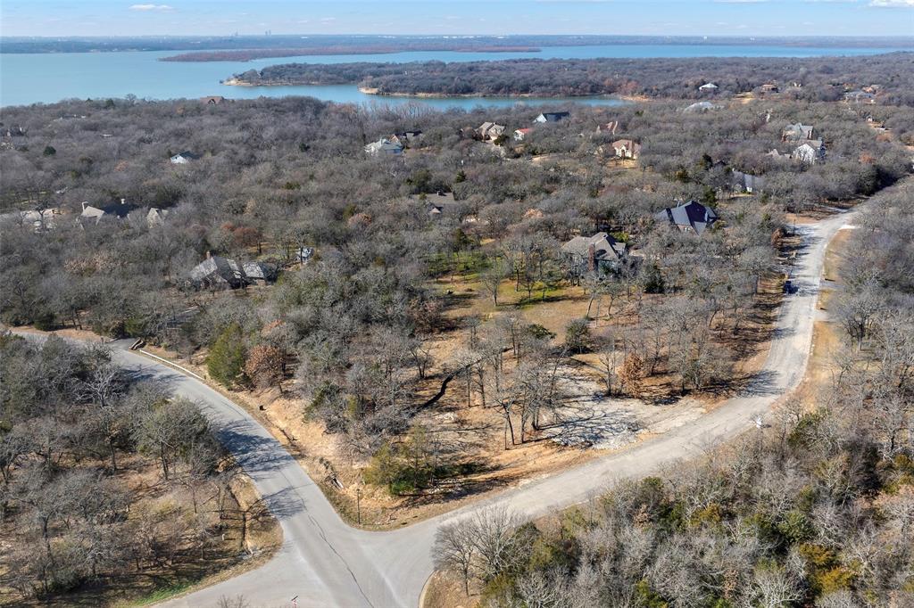 940 Emerald Sound Boulevard Oak Point, TX 75068 - Photo 4 of 8 a view of a dry yard with wooden fence