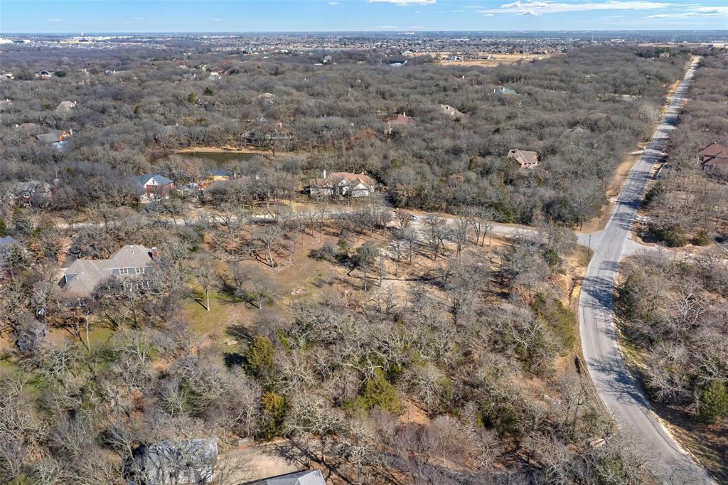 940 Emerald Sound Boulevard Oak Point, TX 75068 - Photo 7 of 8 an aerial view of house with yard and mountain view in back