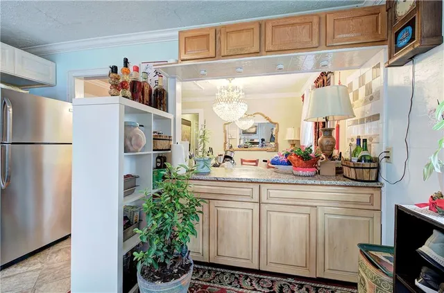 a kitchen with stainless steel appliances a refrigerator and a sink