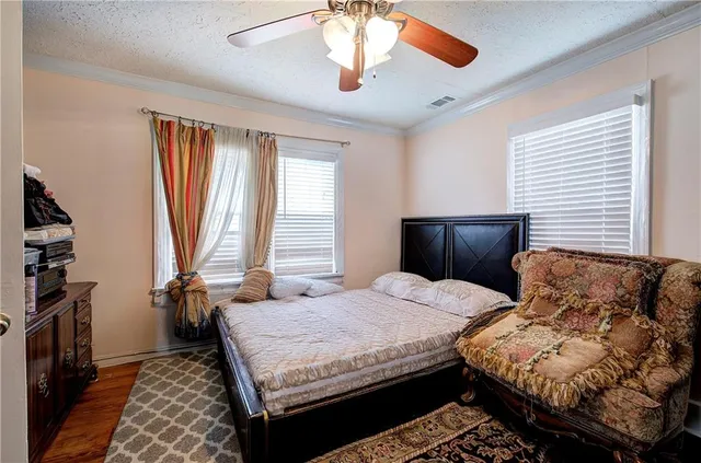 a bedroom with bed and window