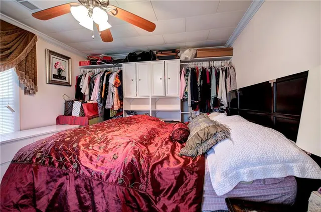 a bed room with a bed and a walk in closet