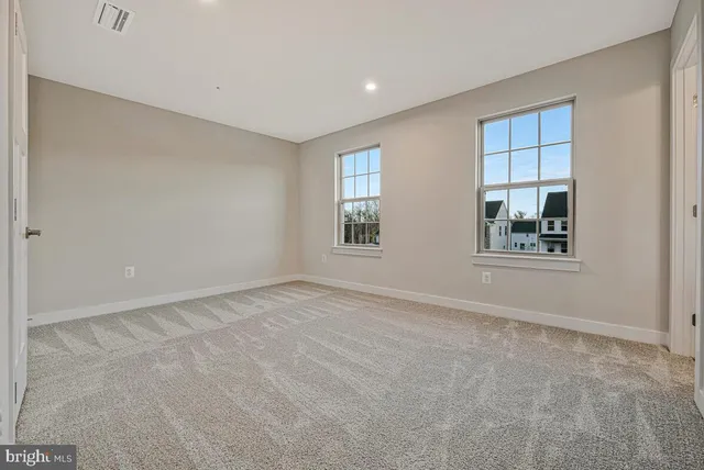 a bathroom with a granite countertop sink toilet a shower and a mirror