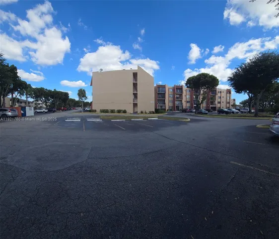 a view of a street with a building in the background
