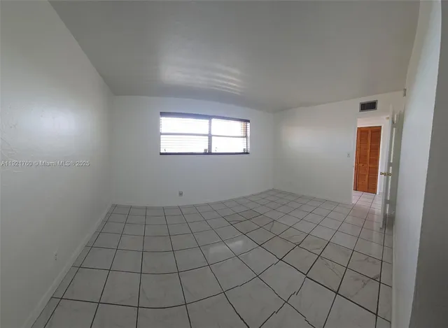 a bathroom with a toilet a sink and shower