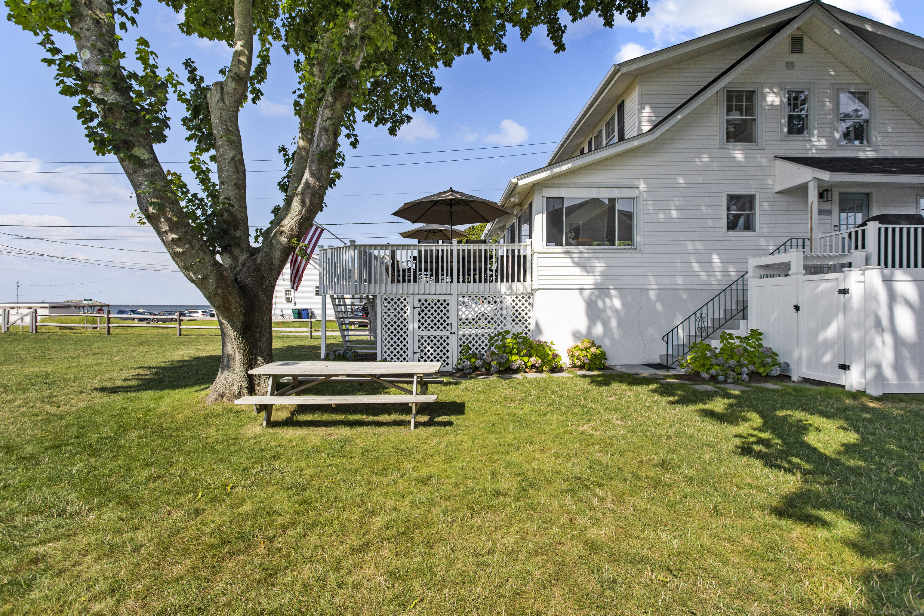 15 Cottage Road Old Lyme, CT 06371 - Photo 22 of 26 a front view of house with yard