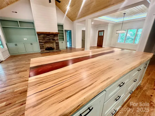 a view of kitchen and hall with wooden floor
