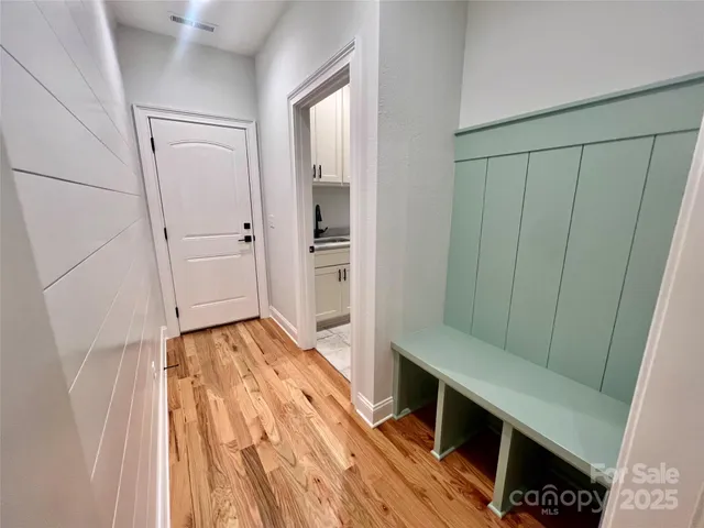 a view of kitchen with furniture and wooden floor