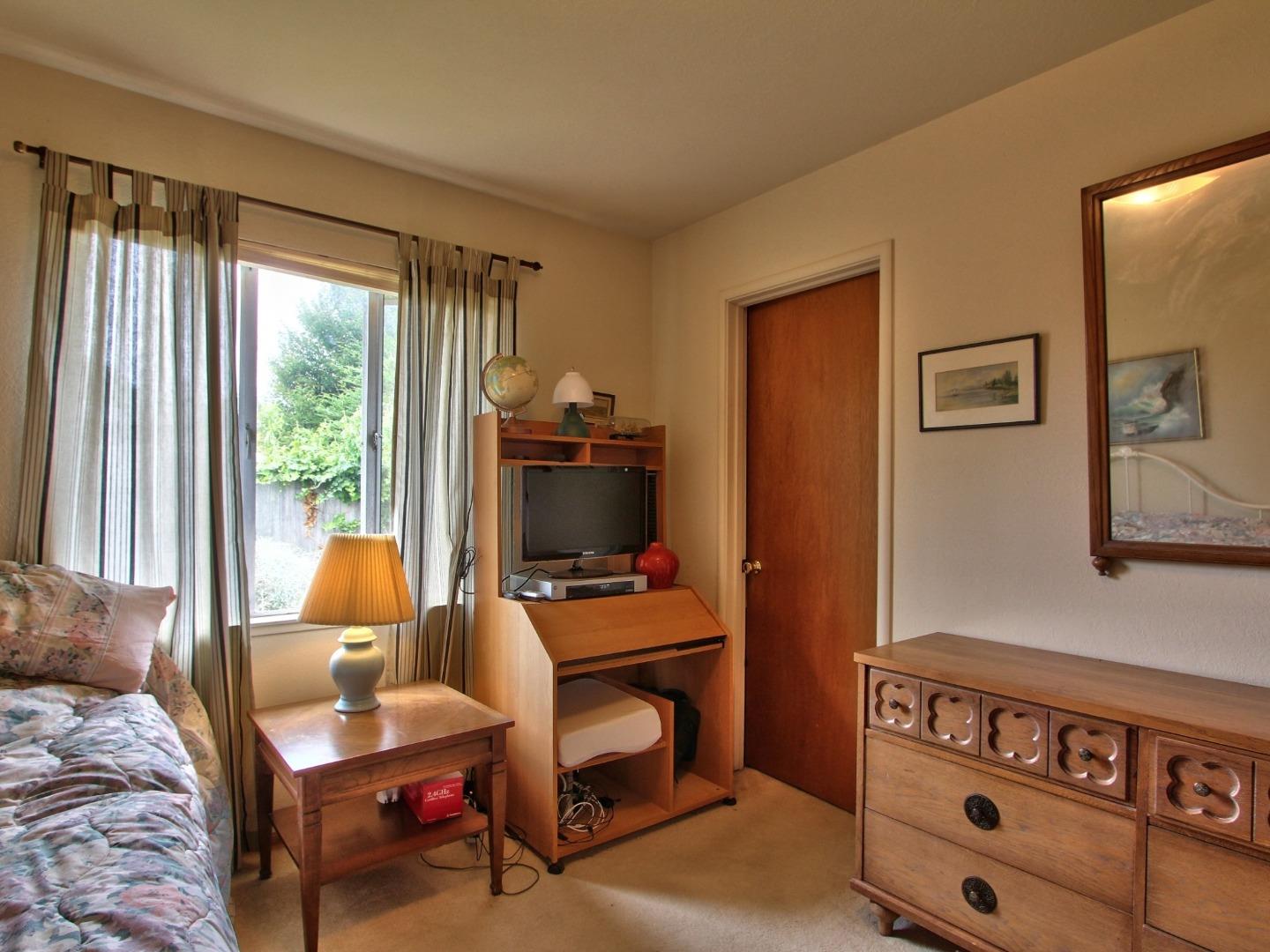 3220 Rio Road Carmel, CA 93923 - Photo 11 of 15 a bedroom with furniture and a window