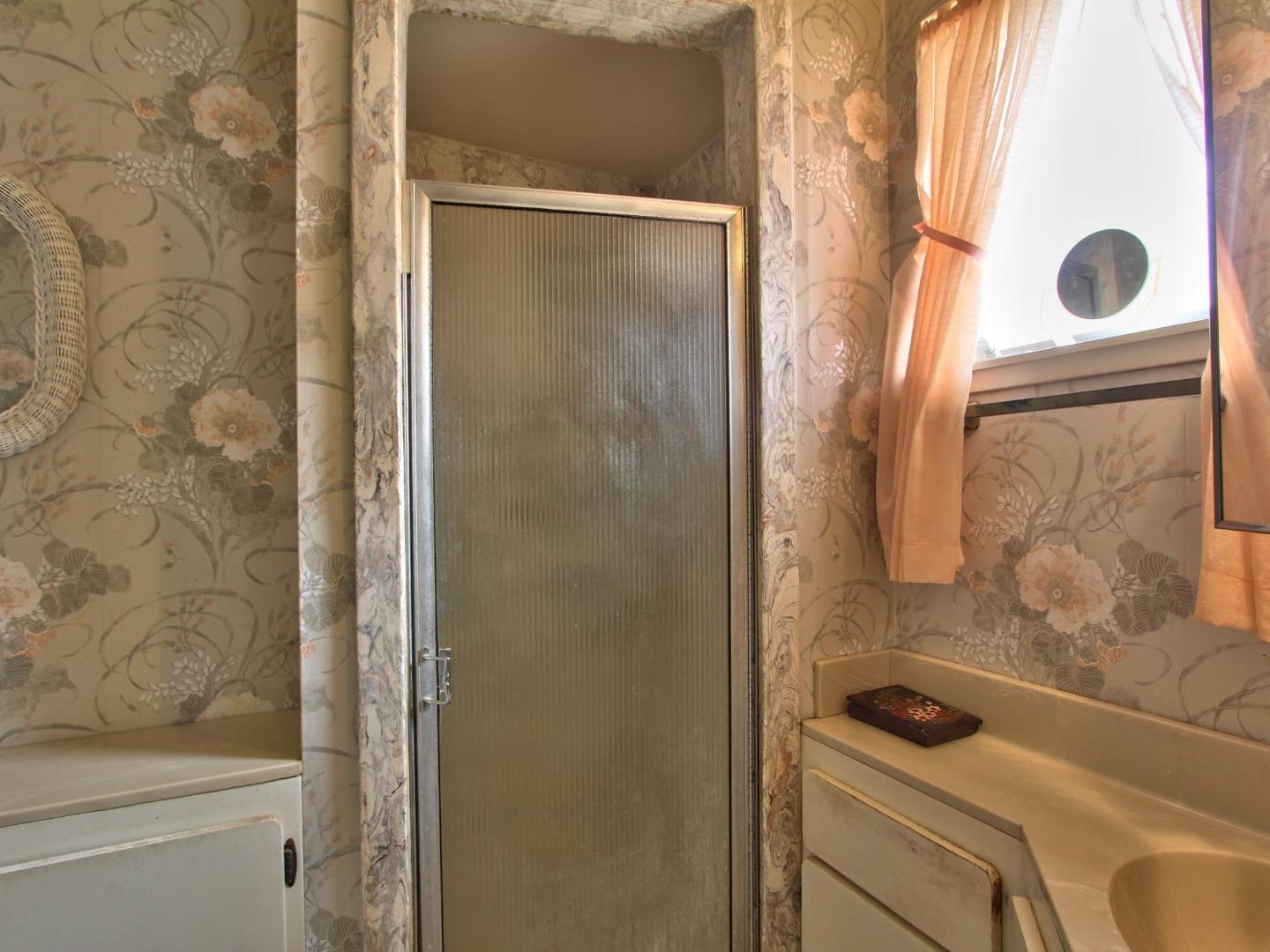 3220 Rio Road Carmel, CA 93923 - Photo 14 of 15 a bathroom with a shower and a sink