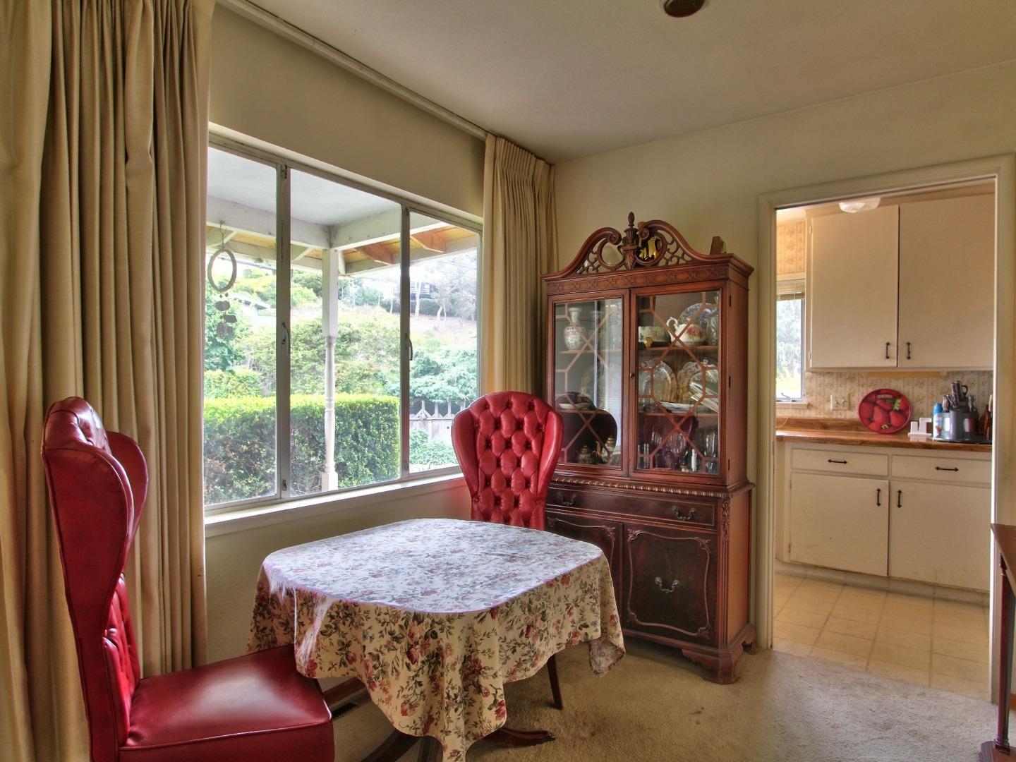 3220 Rio Road Carmel, CA 93923 - Photo 4 of 15 a bedroom with a bed and large windows