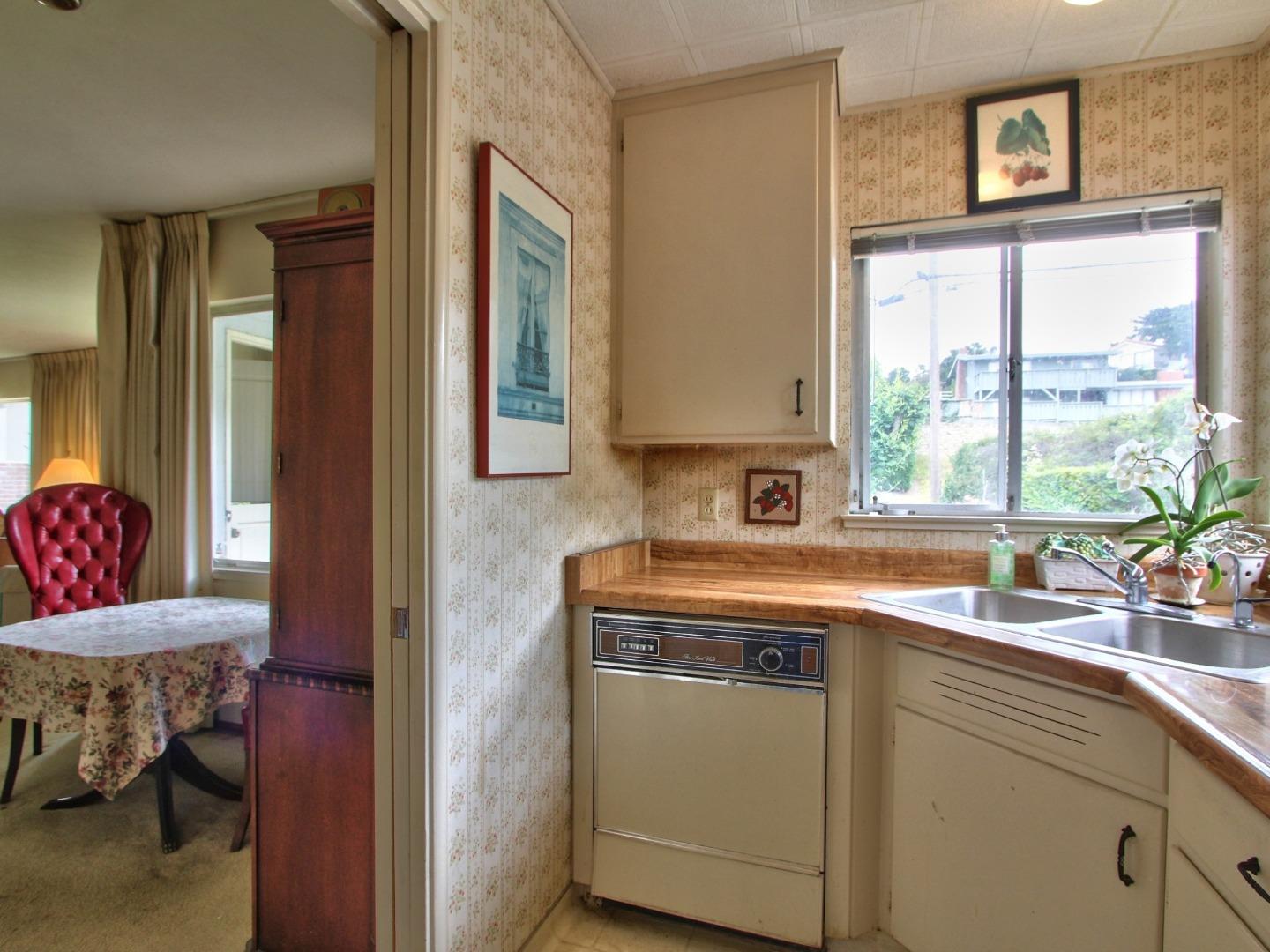 3220 Rio Road Carmel, CA 93923 - Photo 7 of 15 a kitchen with a sink and a window