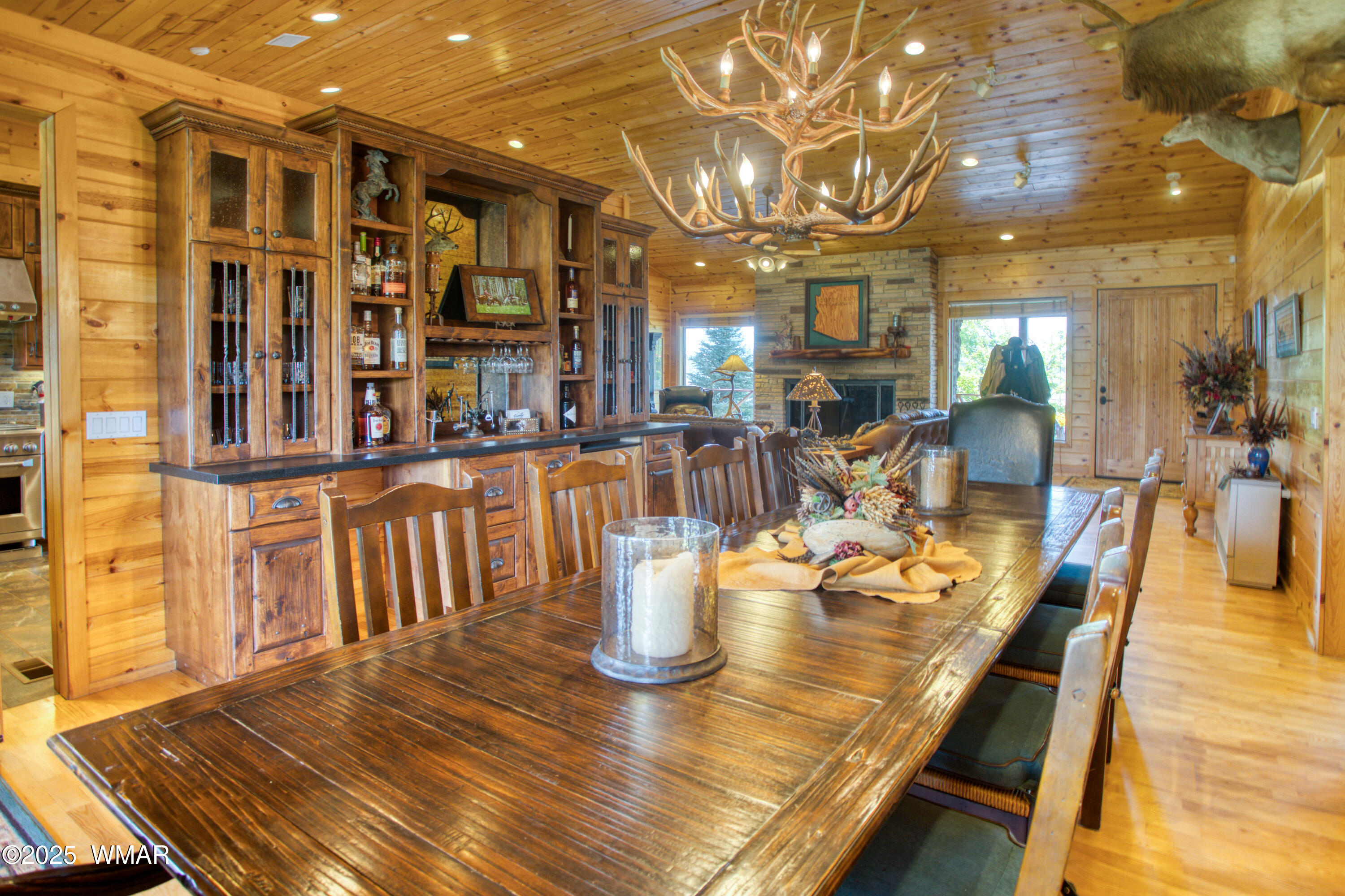 422 B Sponseller Siding Road Pinetop, AZ 85935 - Photo 22 of 74 a view of a dining room and hall with wooden floor