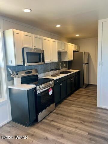 422 B Sponseller Siding Road Pinetop, AZ 85935 - Photo 61 of 74 a kitchen with stainless steel appliances wooden cabinets a sink and a refrigerator