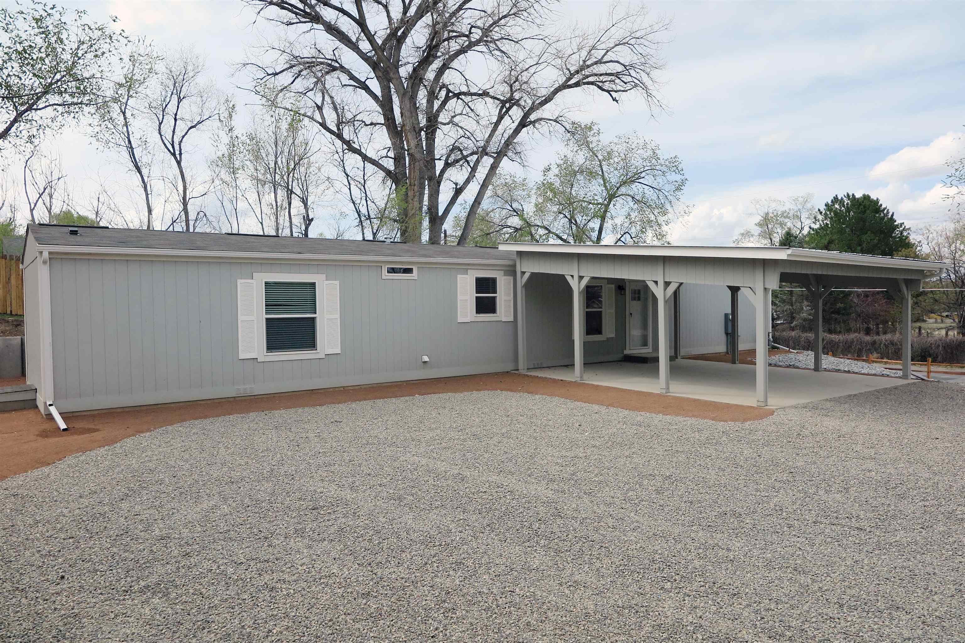 2721 1/2 B 1/4 Road Grand Junction, CO 81503 - Photo 2 of 29 a view of a house with a backyard and a tree
