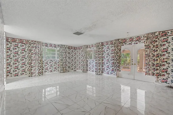a bathroom with a sink a mirror and a shower
