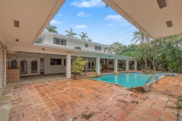 a view of a field with trees