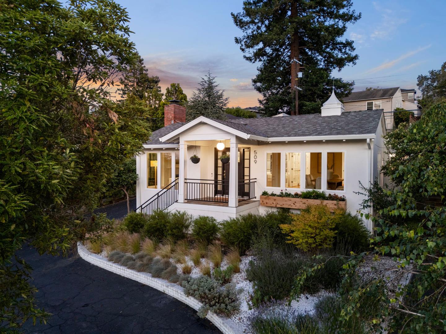 a front view of a house with a yard and porch