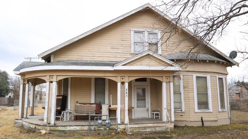 front view of a house with a small yard