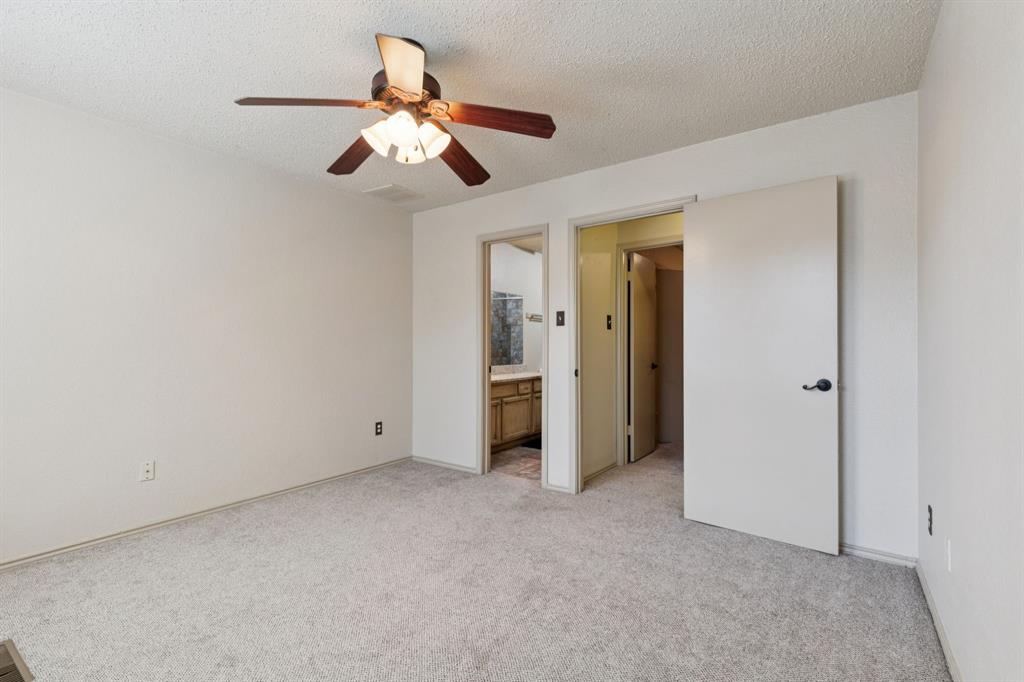 449 Harris Street, Unit 103B Coppell, TX 75019 - Photo 22 of 26 a view of an empty room with chandelier fan