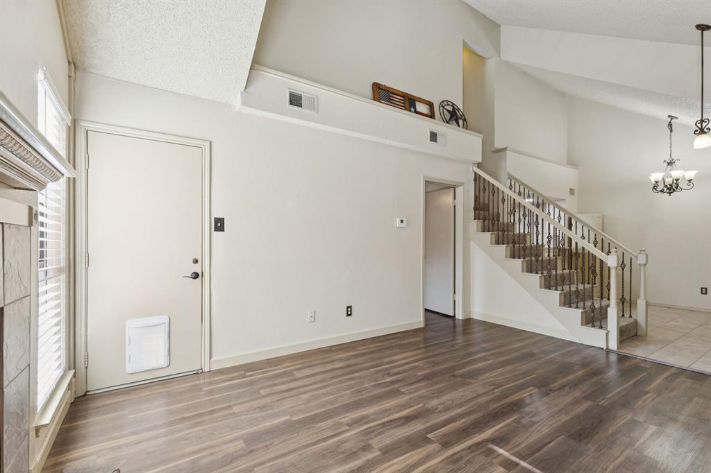 449 Harris Street, Unit 103B Coppell, TX 75019 - Photo 7 of 26 a view of a room with wooden floor and staircase