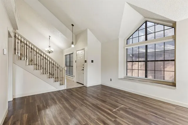 a view of an entryway with wooden floor
