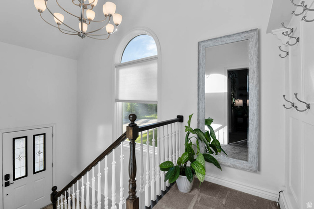 10686 South Covered Brg Cyn Road, Unit 14 Spanish Fork, UT 84660 - Photo 39 of 44 Arched window providing natural illumination, complemented by a contemporary chandelier