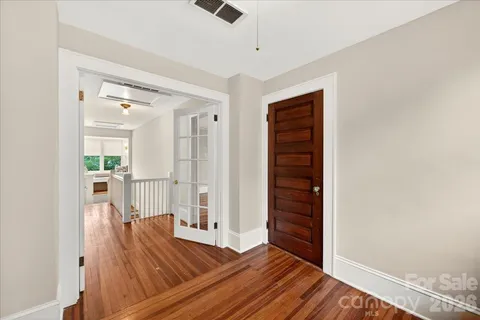 a view of a livingroom with wooden floor