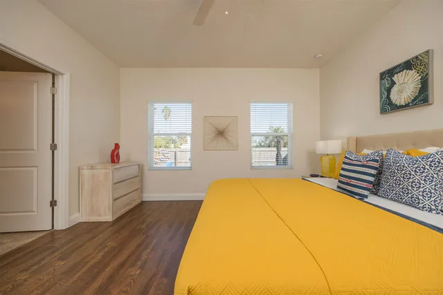 a spacious bathroom with double sink and a mirror