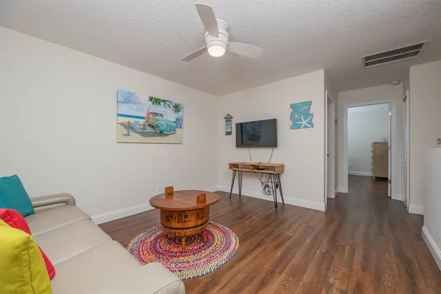 a bedroom with a bed and a lamp