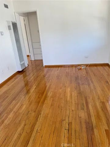 wooden floor in a white room
