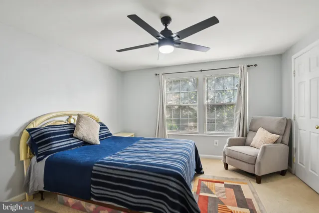 a bedroom with a bed and a couch