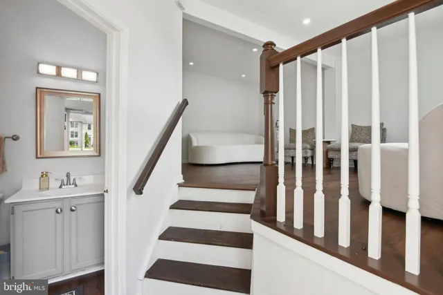 a view of entryway with stairs and wooden floor