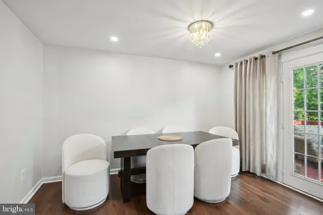 a very nice looking room with a chair and a large window